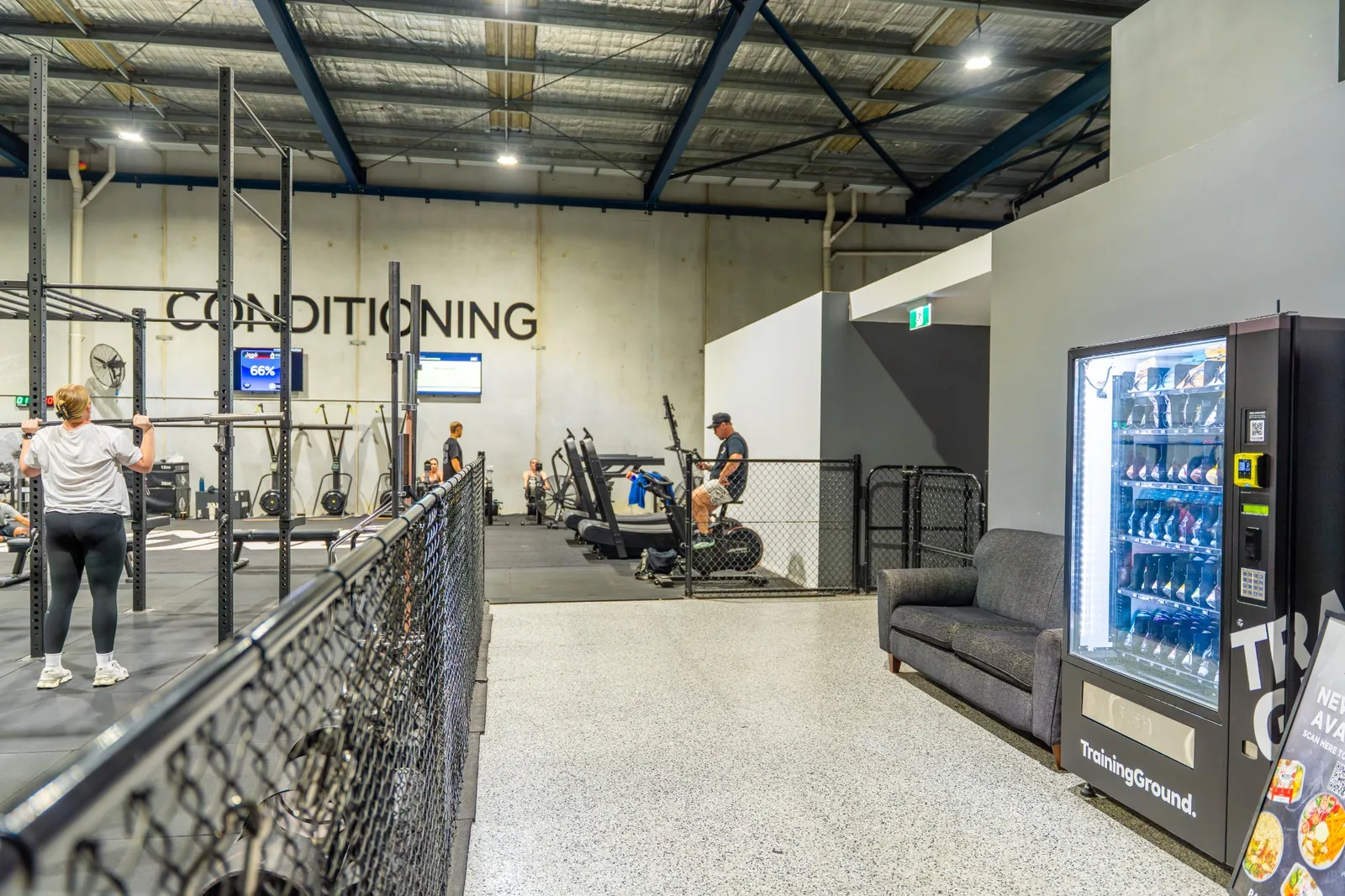 Stocked Pure Vend Vending Machine installed in an active gym